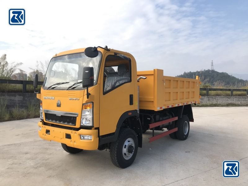 Side view of HOWO 4X4 tipper truck - vehicle's side profile, tyres and cockpit on show