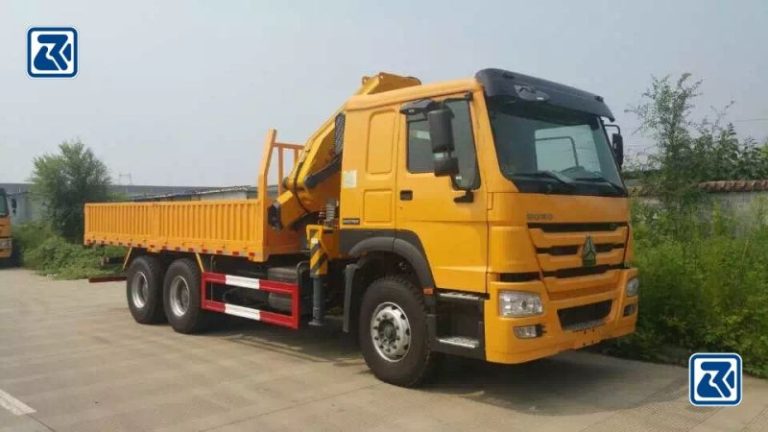 Side view of a sturdy Howo 6x4 crane truck, highlighting its spacious cargo area and advanced crane technology