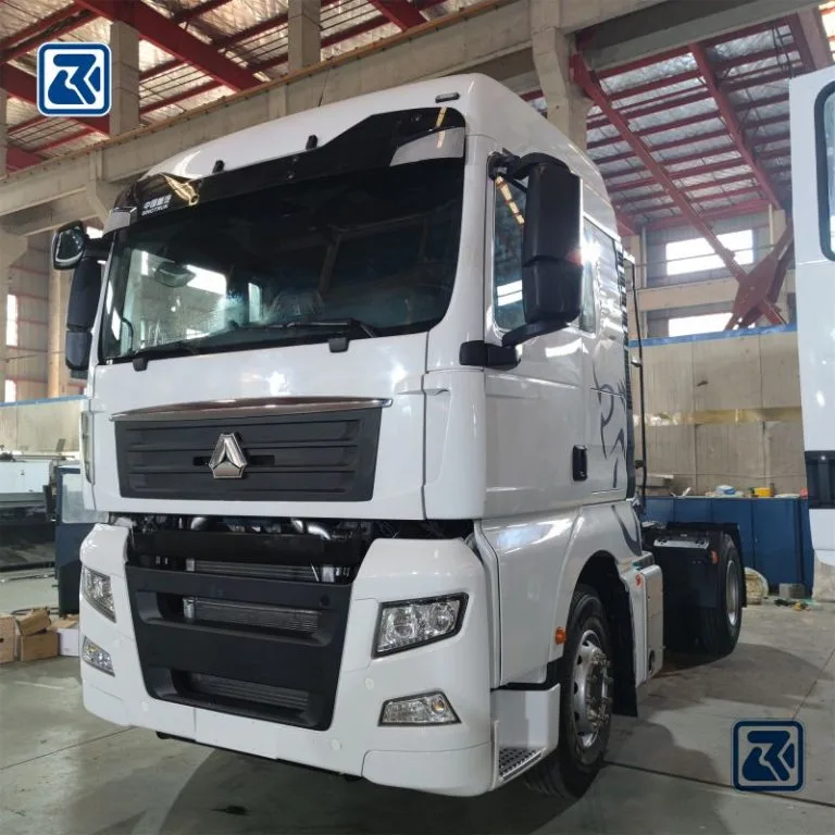 Frontal view of a SITRAK 4X2 tractor truck in an assembly line, focusing on its modern cabin design