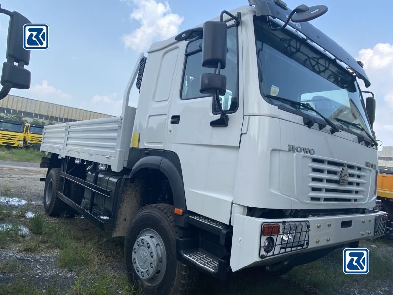 Close-up of HOWO 4x4 cargo truck cabin and front chassis on a shipping flatbed