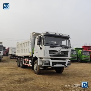 Front view of the Shacman F3000 Dump Truck 6X4 - sturdy front assembly and powerful engine compartment.