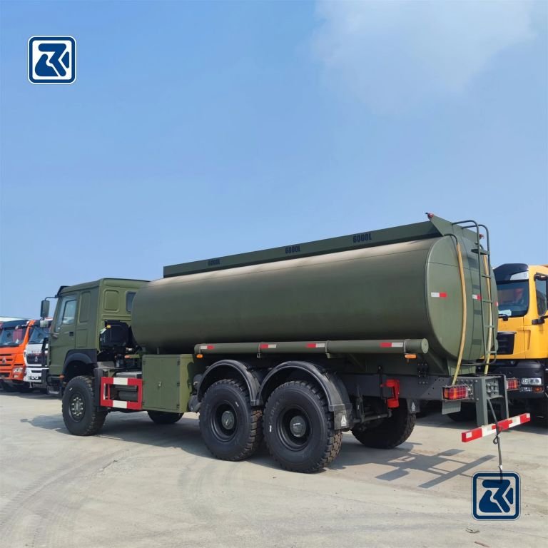 Rear side view of HOWO tanker truck with hydraulic system components and tank connections