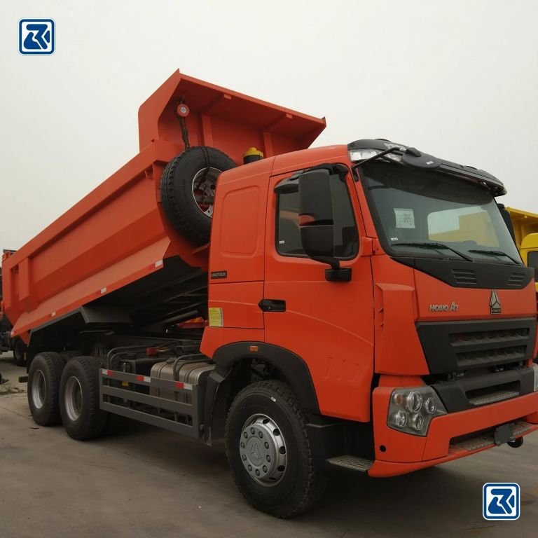 Orange HOWO dump truck with raised bed, side view