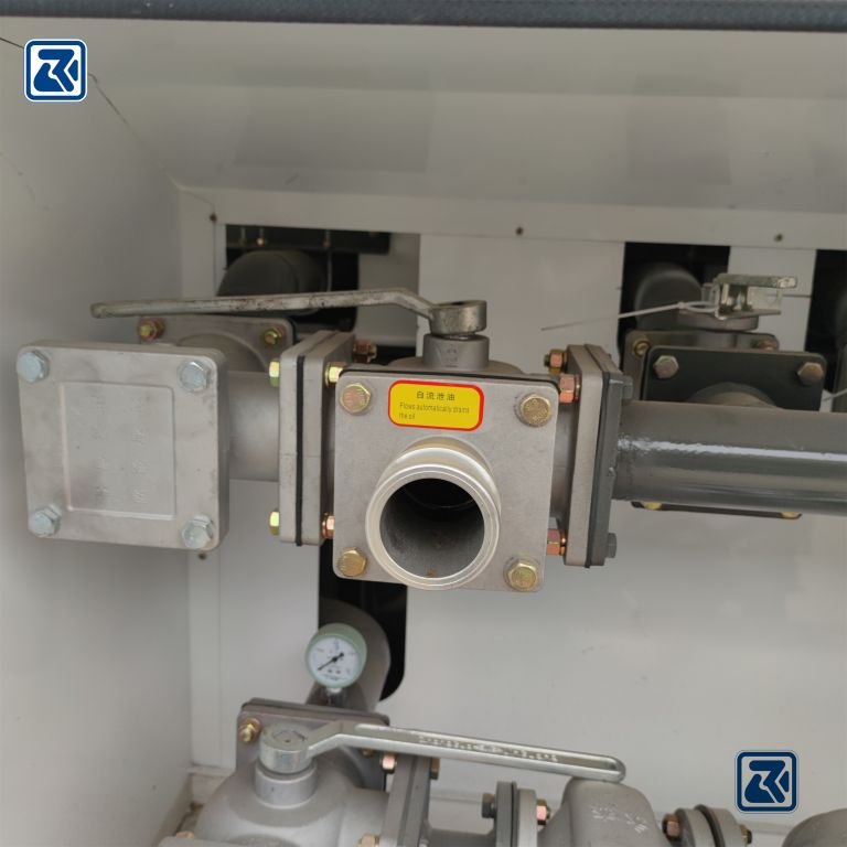 HOWO tanker oil drain outlet showing drain device and valves.