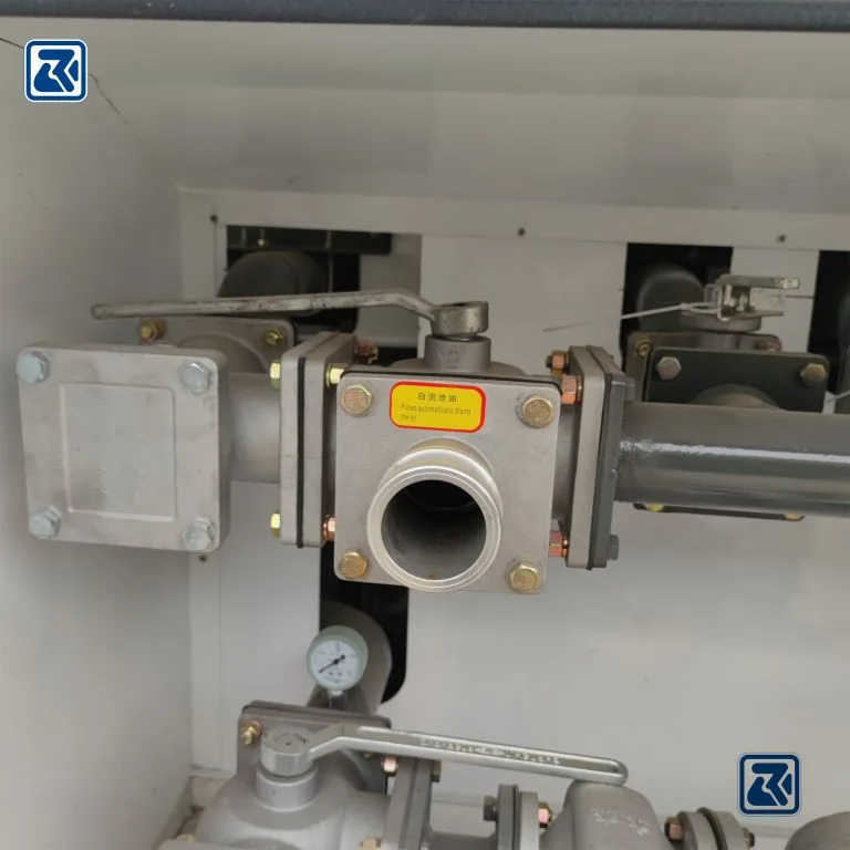 HOWO tanker oil drain outlet showing drain device and valves.